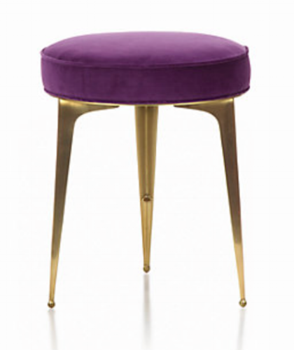purple upholstered stool with three gold legs
