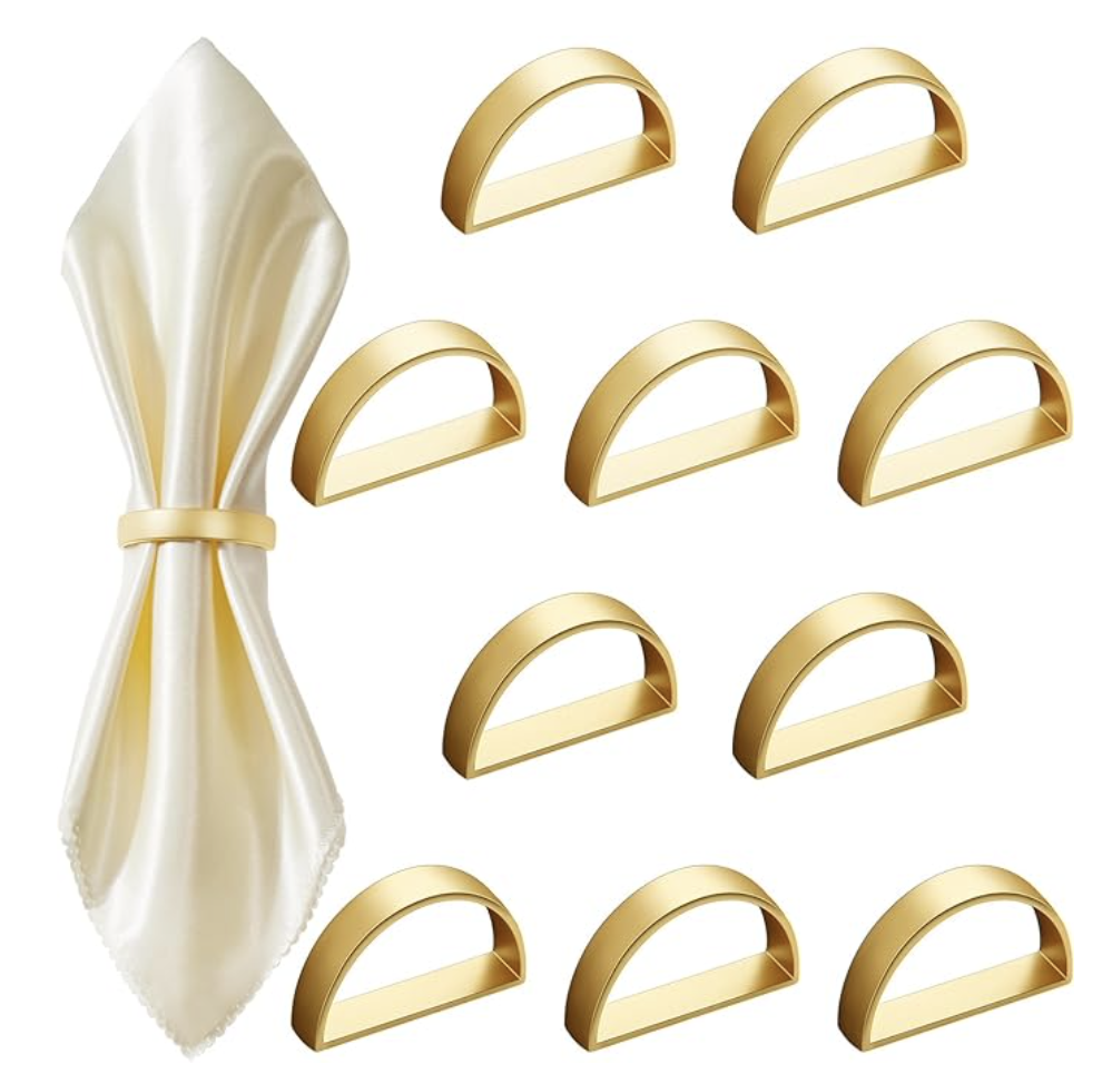 smooth contemporary gold napkin rings, one shown using a cloth napkin